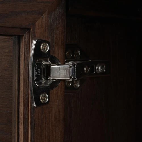 Metal hinge close-up showing how door attaches to cabinet.