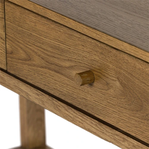 Close-up of the drawer front with wooden knob.