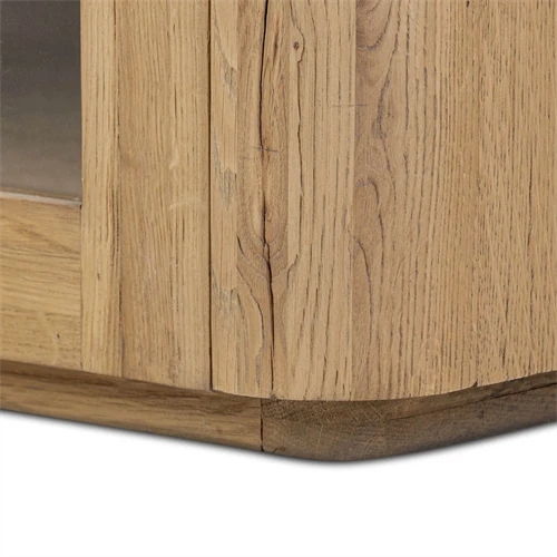 Corner detail of wooden cabinet showing timber grain and base