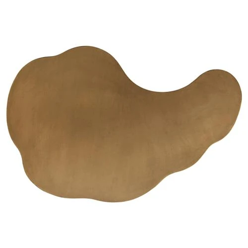 Close-up of a curved edge on a gold metal piece showing seam or joint detail.