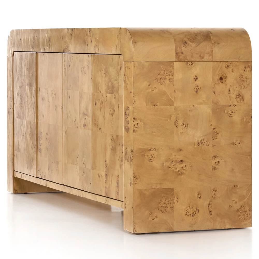 Close-up of rounded corner and burl pattern on the wood surface of the sideboard.