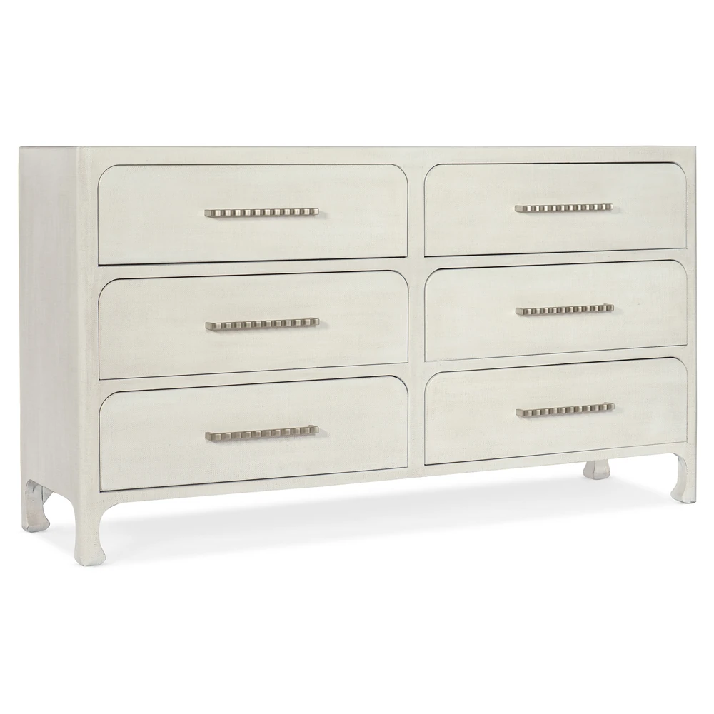 A white dresser with six drawers from an angle