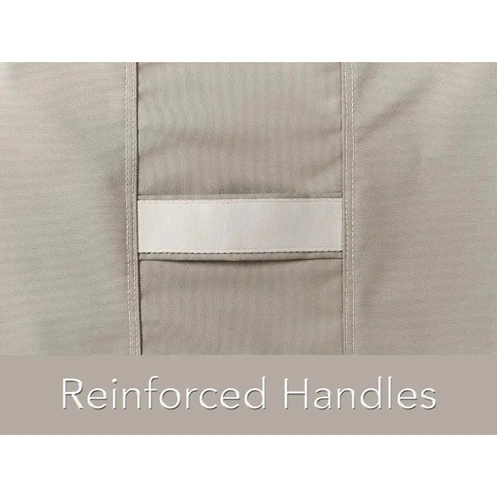 Close-up of reinforced handle strap detail on beige fabric, showing stitching