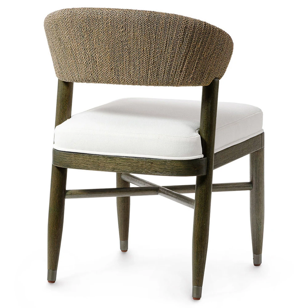 Rear view of chair with white cushion and brown woven backrest