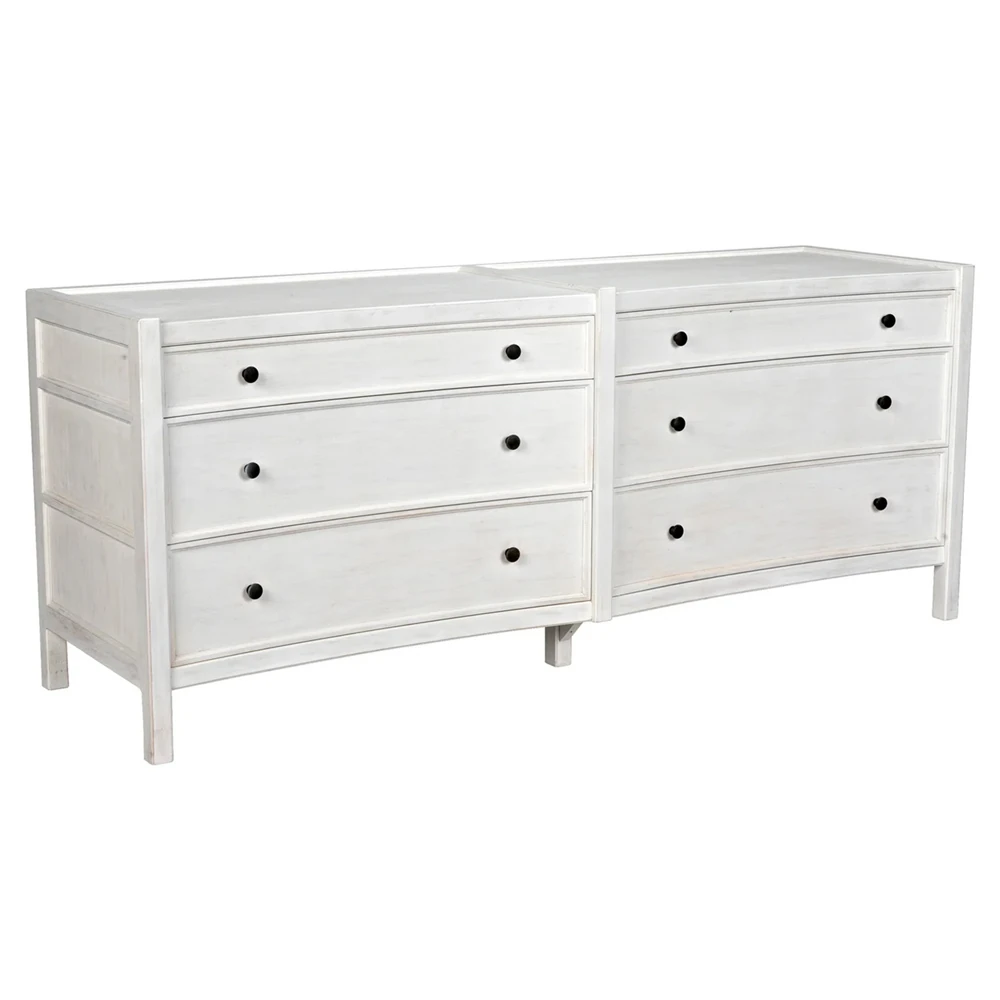 Close-up of paneled drawer fronts with mortise-and-tenon detailing on a white weathered dresser.