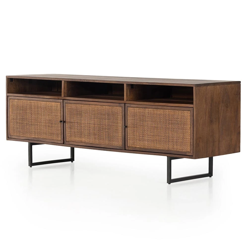Close-up of woven rattan cabinet doors with small black knobs on a wooden sideboard.
