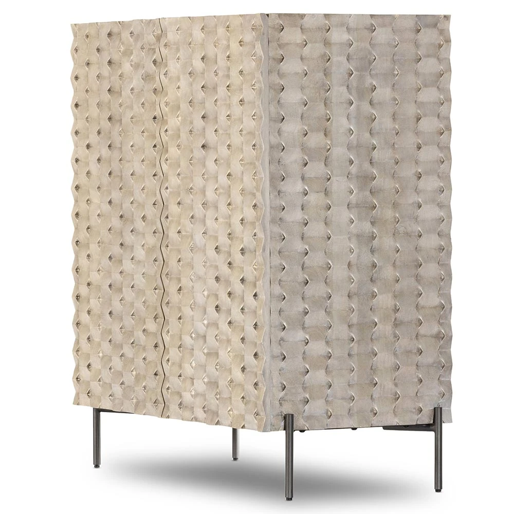 Close-up of the textured beige surface with diamond-shaped indentations on the cabinet.