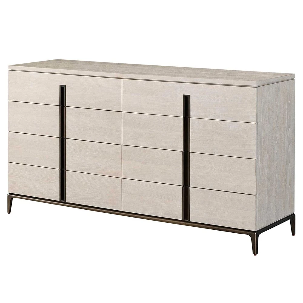 An angled view of a light-colored wooden dresser with eight drawers and black metal accents.