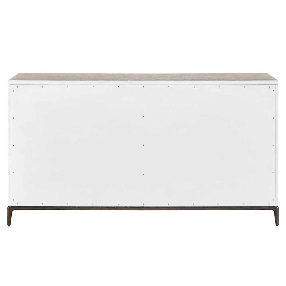 The back of a light-colored wooden dresser with a white finish and black metal legs.