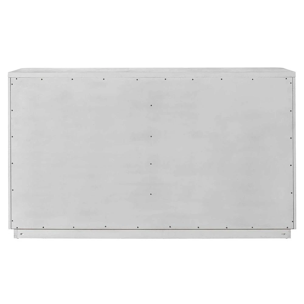 The back of a white wooden dresser with eight drawers.