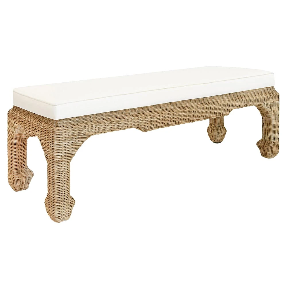 Close-up of woven rattan bench showing detailed wicker weave and curved legs.