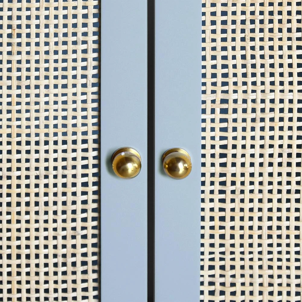 A close-up of the bathroom vanity's gold knobs.