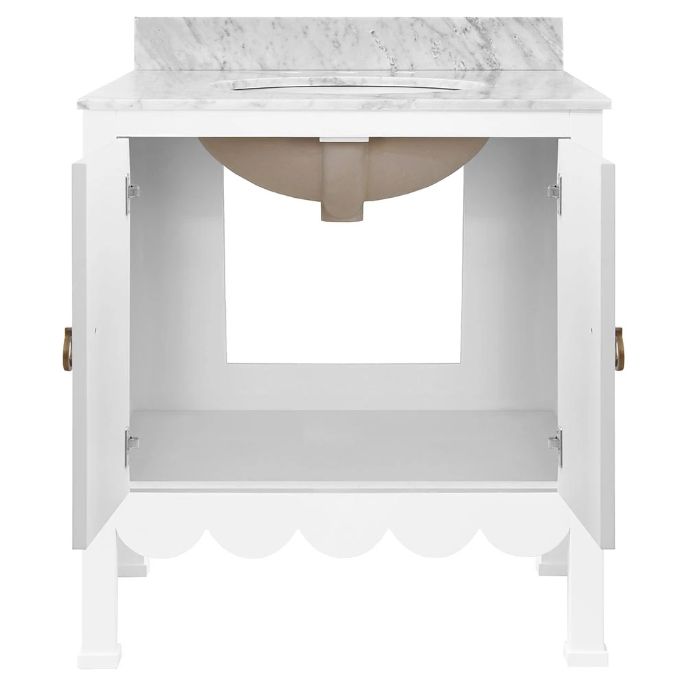 Open white bathroom vanity under sink showing interior cabinet space and plumbing cutout.