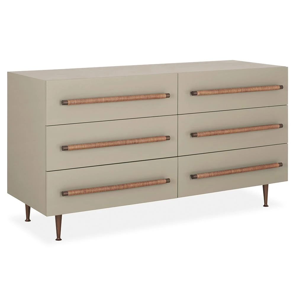 A beige dresser with six drawers and wooden handles, viewed from an angle.