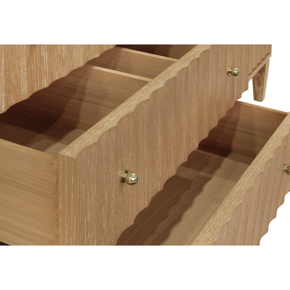 A close-up of an open drawer on a wooden vanity