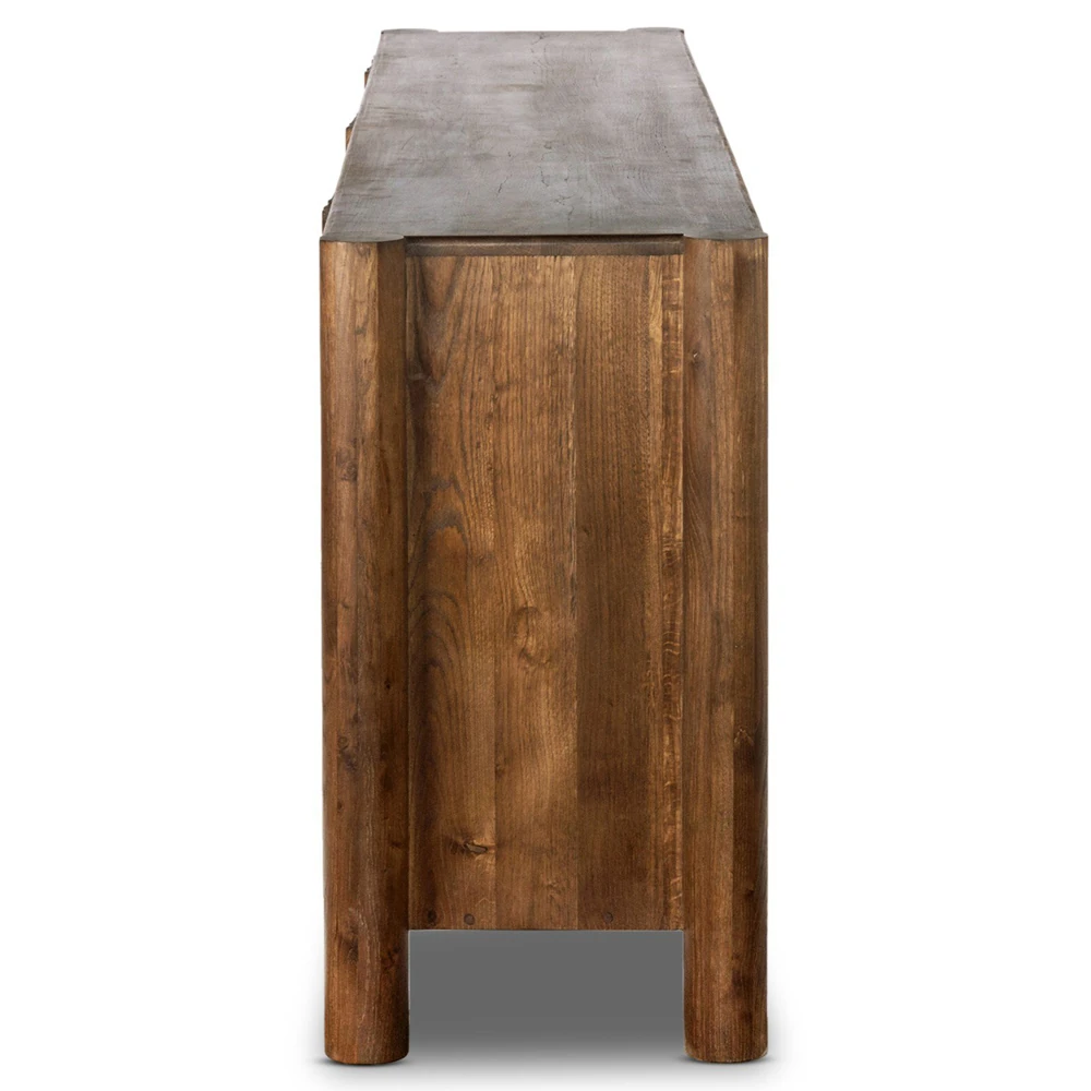 Close-up of carved wood grain and round wooden feet on the sideboard.