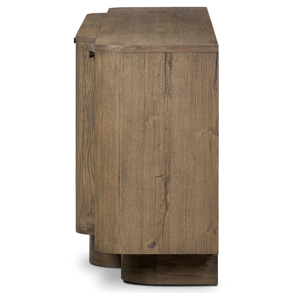 Close-up of the wood grain and curved top edge of the cabinet showing a natural brown finish.