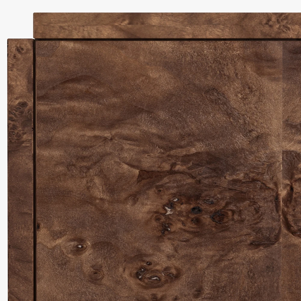 Detailed texture of the burl wood surface and intricate figuring in the wood grain.