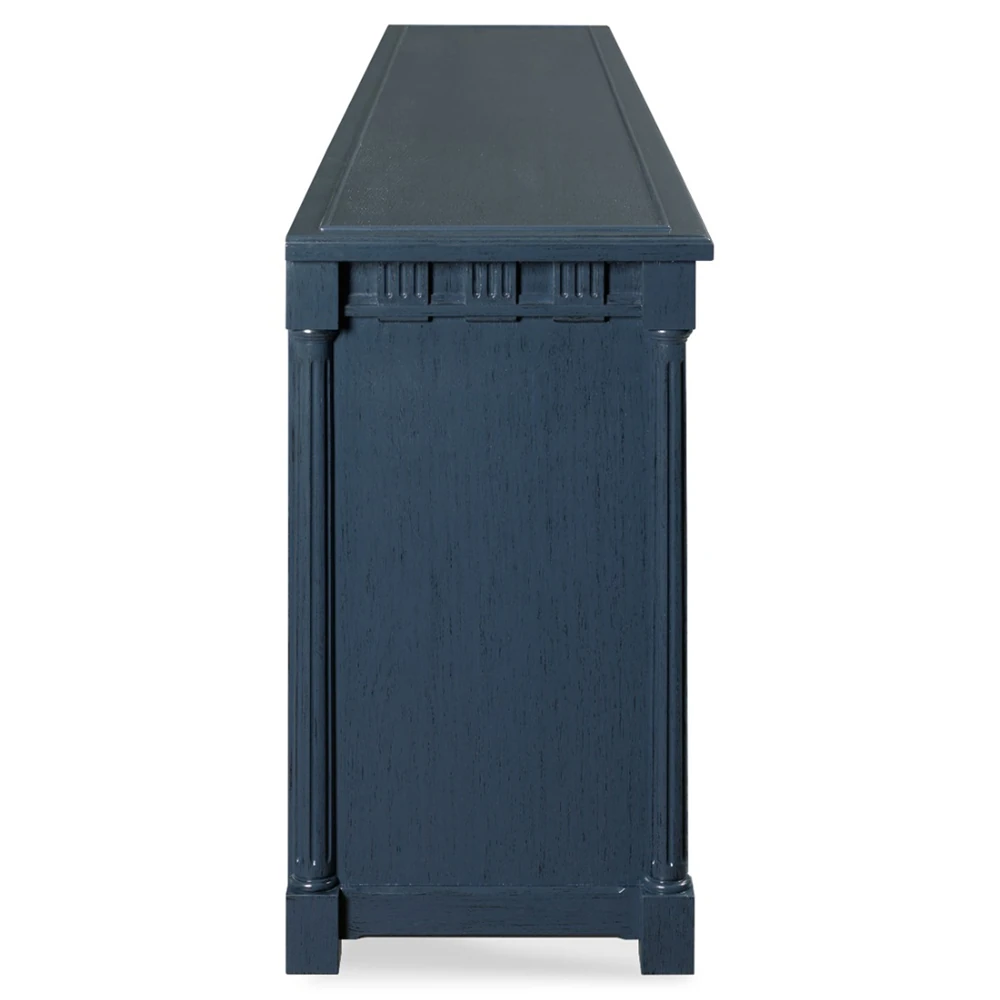 The back of a dark blue cabinet with gold handles.