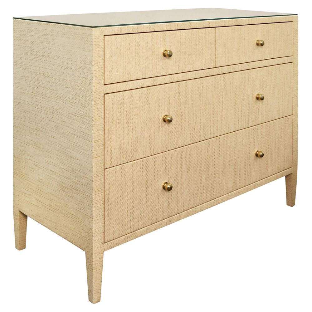 Close-up of the same light wood dresser showing drawer fronts with brass knobs and wood grain details.