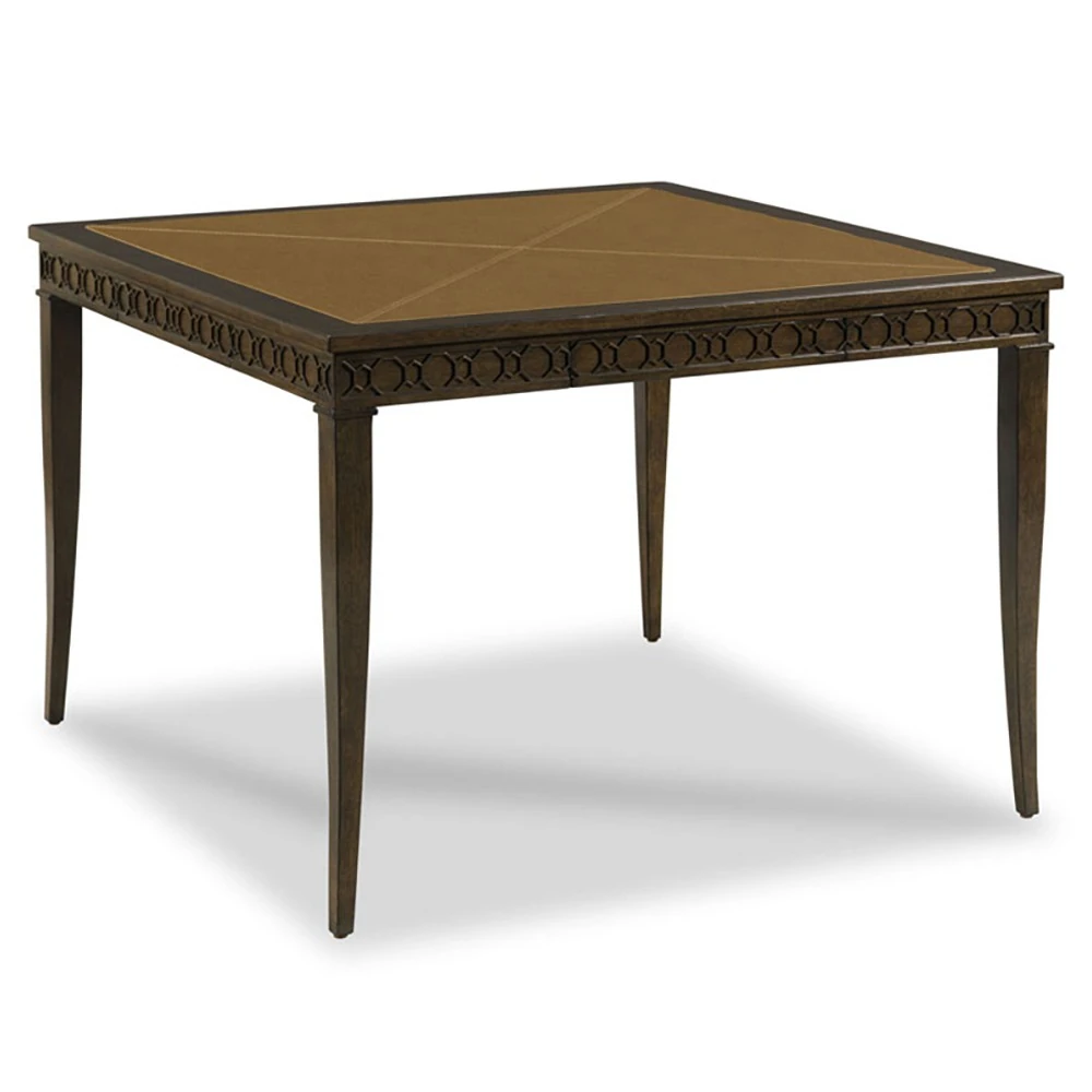 Close-up of the leather-inset tabletop showing tan stitched panels and dark wood frame.