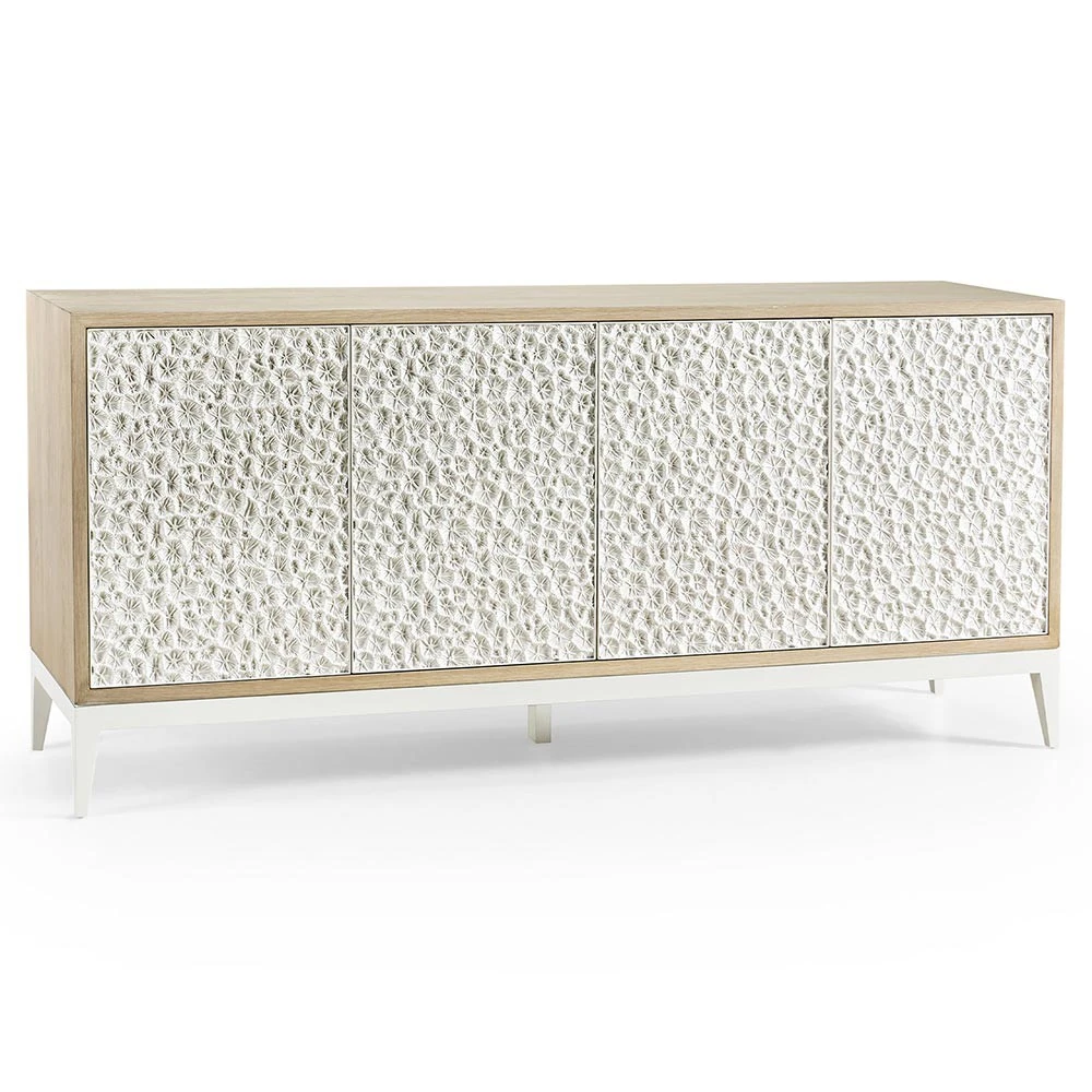 Close-up of the textured white cabinet doors showing circular floral pattern on the sideboard.