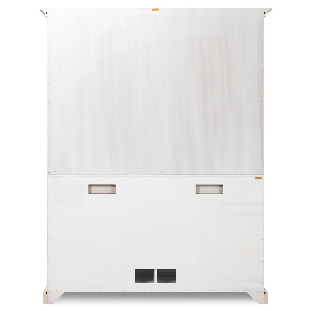 Detail of white wooden crown molding and corner join on top edge of cabinet.