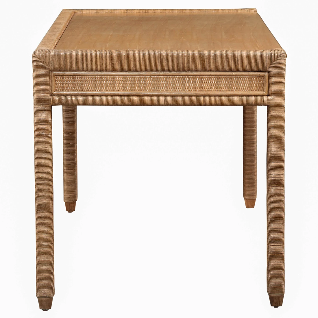 A rectangular desk with a light brown wooden top and a wicker frame, featuring one drawer.