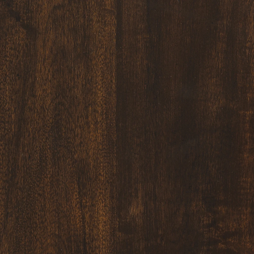 A close-up of the wood grain on a dark brown wooden desk.