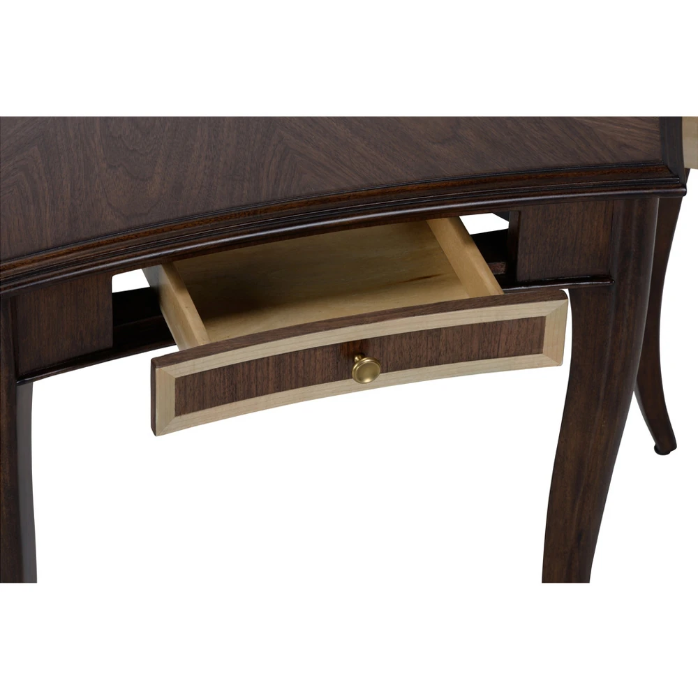 A close-up of a drawer on a dark brown wooden desk.