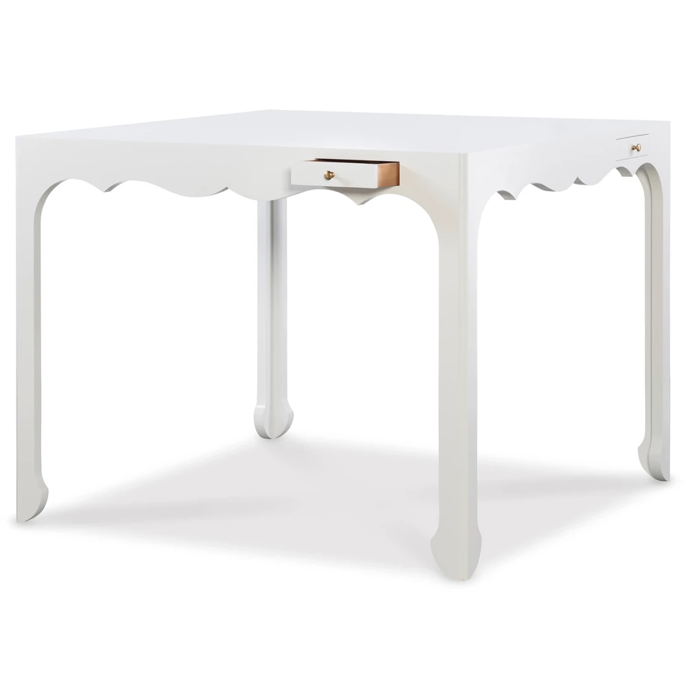 White table with two drawers and scalloped edge from another angle