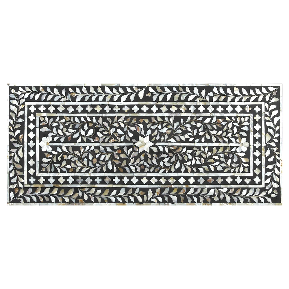 A close-up of the intricate design on the chest of drawers