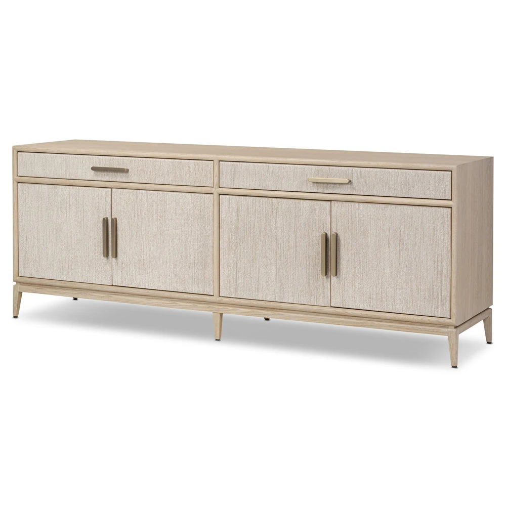 Close-up of top drawer front with textured panel and horizontal brass handle.