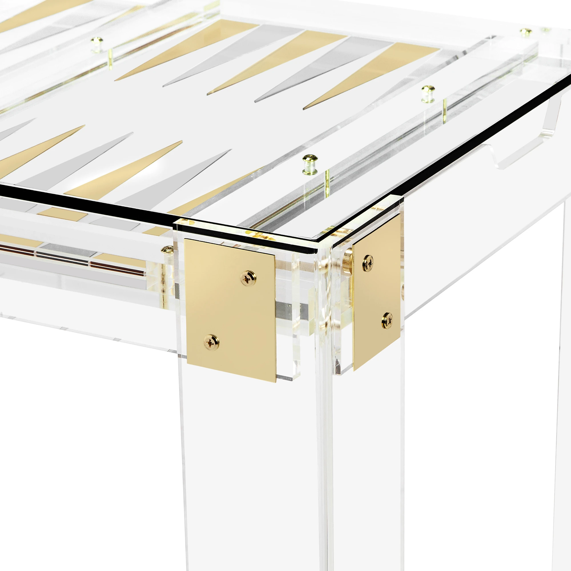 A close-up of the gold accents on a clear glass table