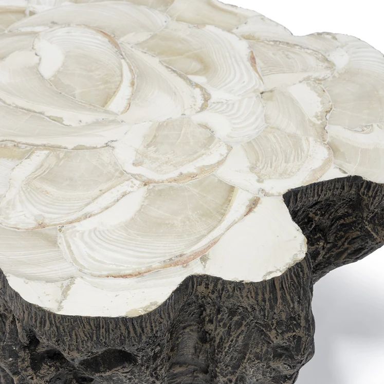 A close-up of the coffee table's white marble top, showcasing its intricate, swirling pattern.