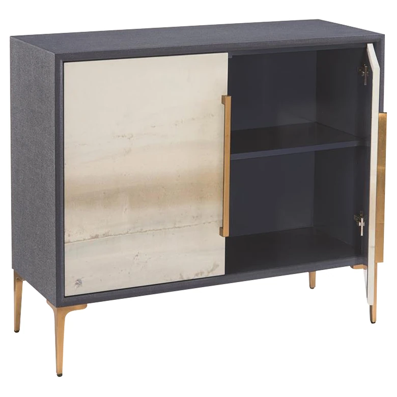 a cabinet with one door open and gold legs