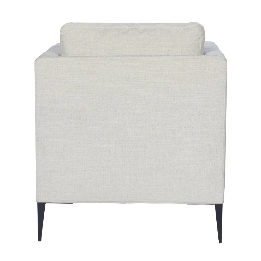Close-up of the chair leg and base with black tapered legs.