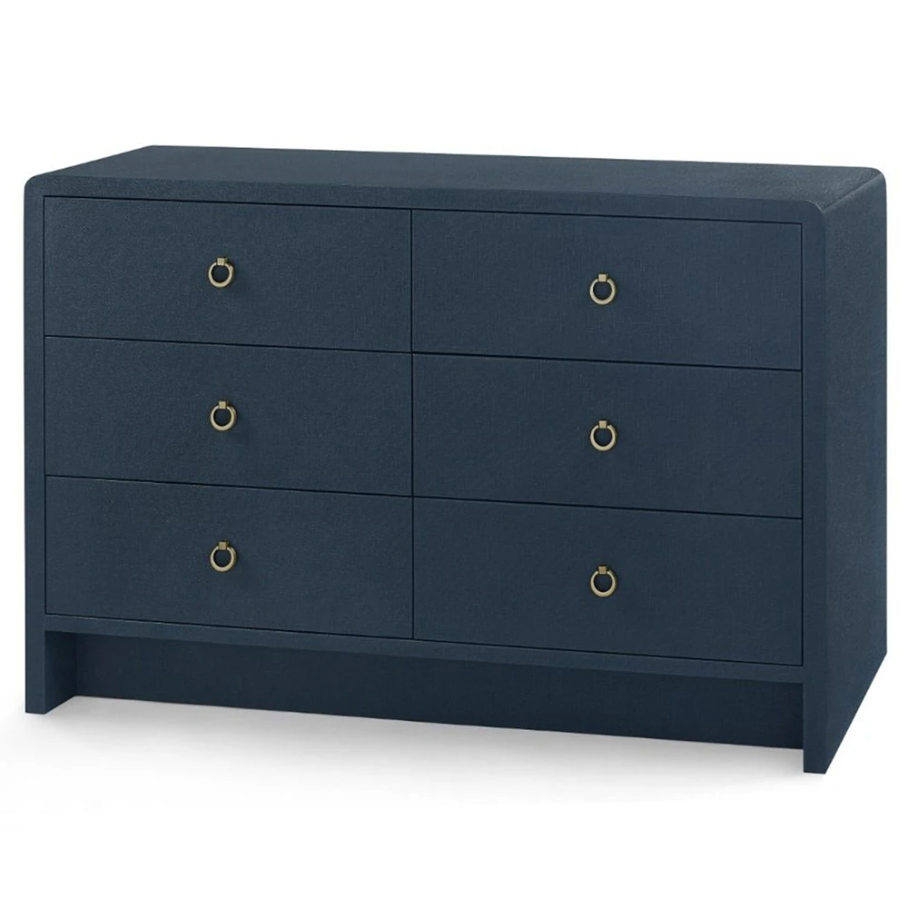 Close-up of the dresser corner showing the fabric texture and rounded edge detail.