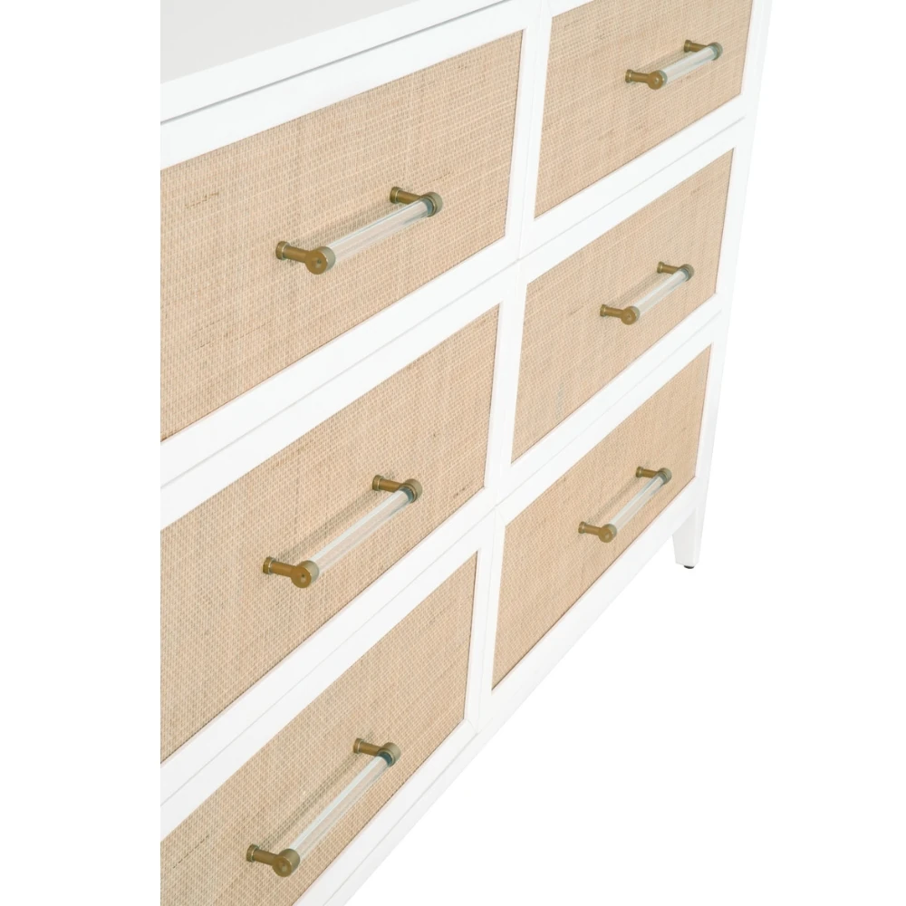 a close-up of the woven rattan fronts and clear handles of three drawers