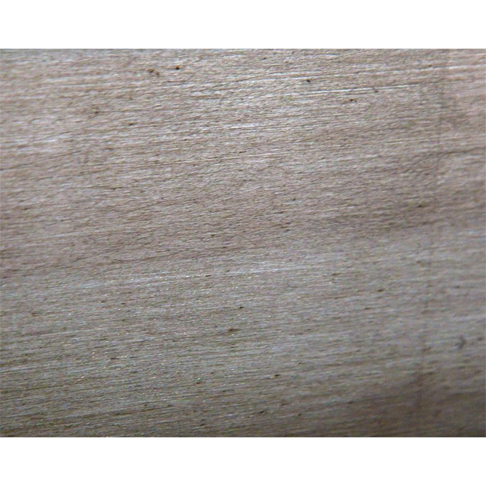 A close-up of the concrete surface of the coffee table, showing its texture and pattern.
