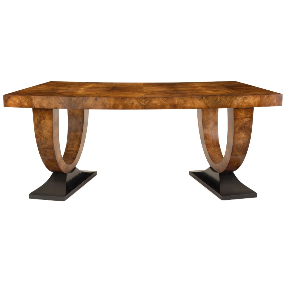 A wooden table with a rectangular top and curved legs.